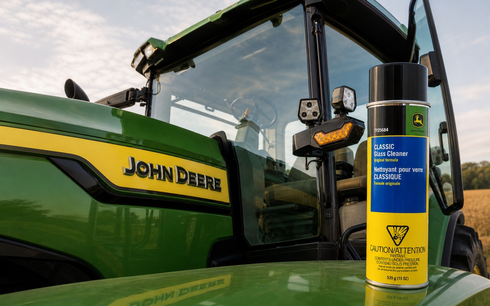 John Deere Classic Glass Cleaner TY25684 beside a John Deere tractor cab