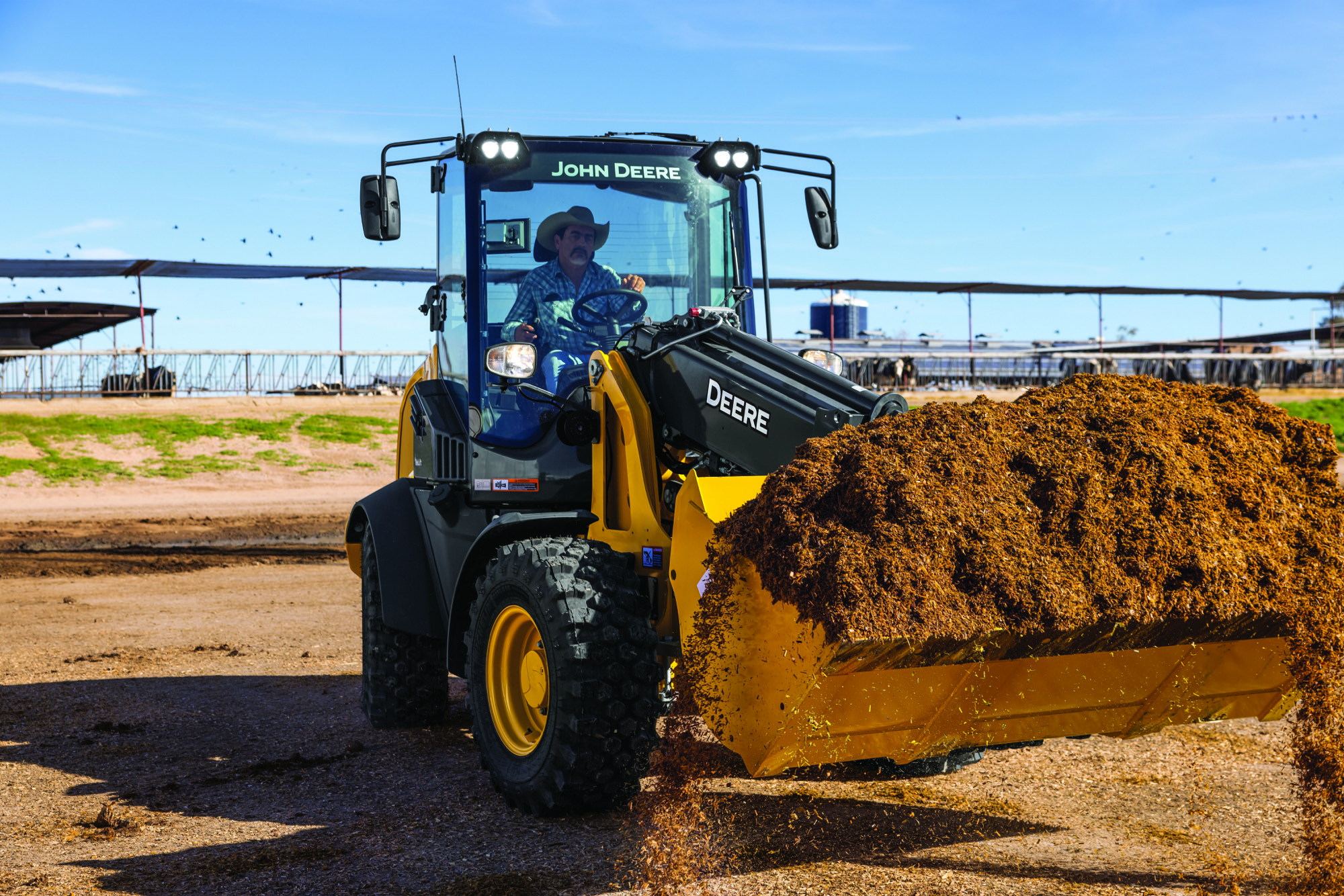 John Deere 326 P-Tier compact wheel loader working on a United States jobsite