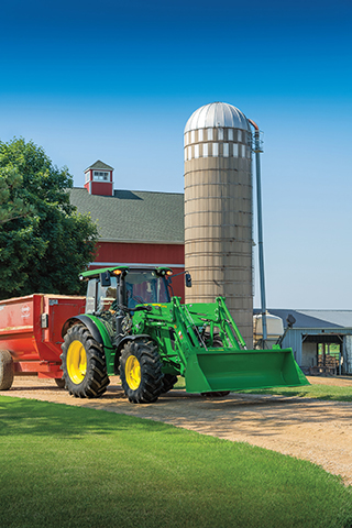 Special financing: A picture of a John Deere tractor with a front loader in front of a red barn and a tan silo.