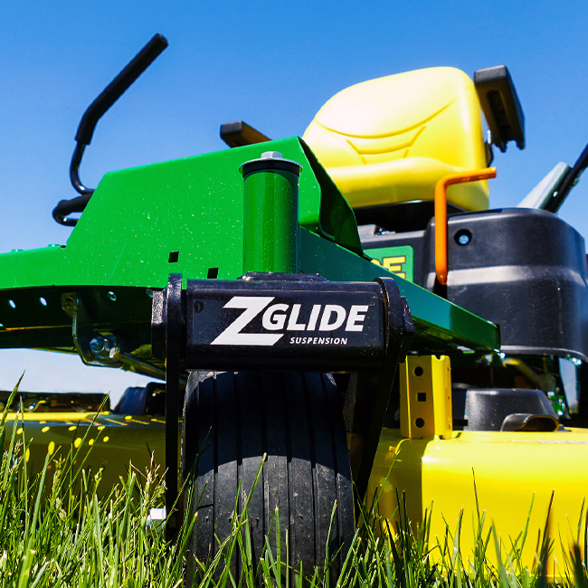 John Deere mower with ZGlide Suspension in the forefront.