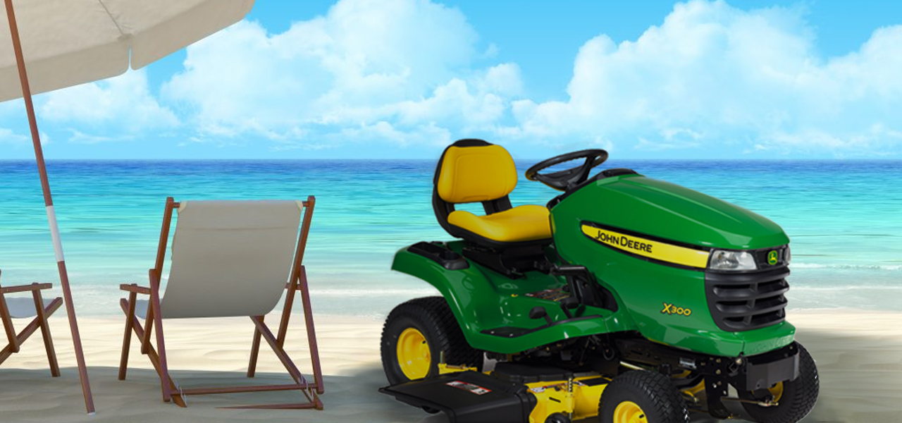 A picture of a John Deere Lawn mower on spring break. It is next to a beach chair. The lawn mower is shaded from the sun by a beach umbrella.