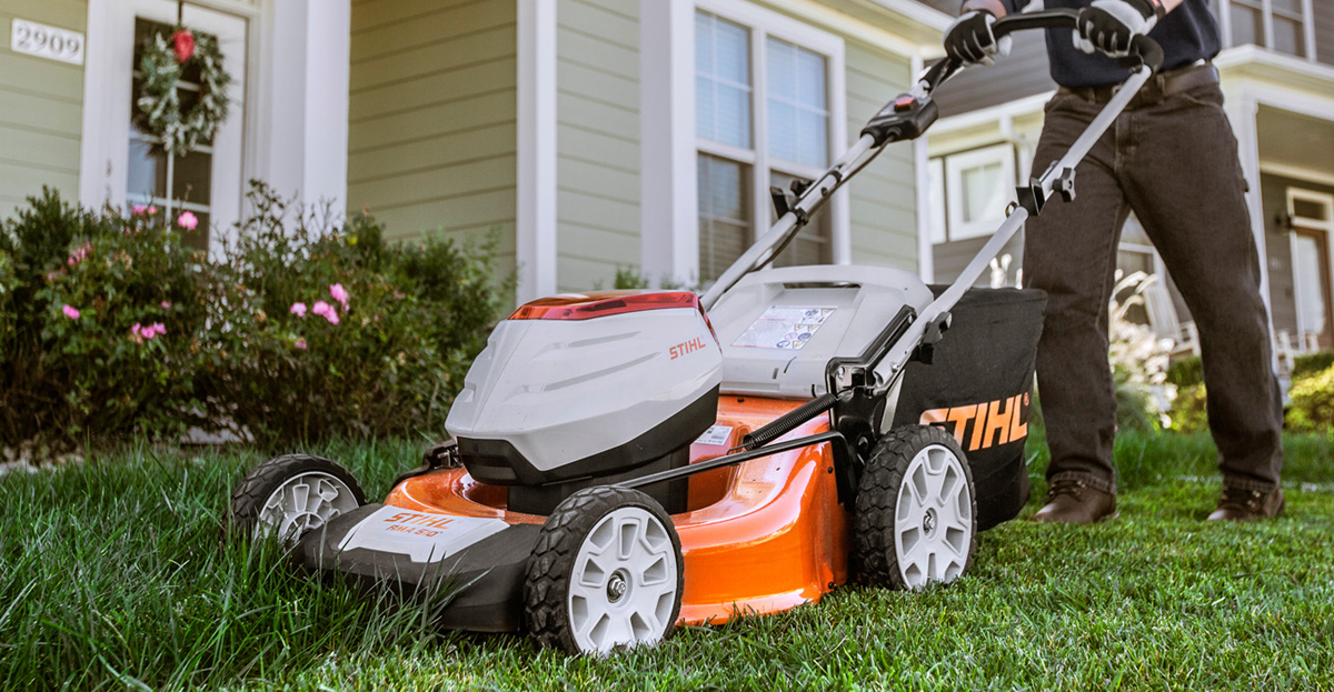 RMA 510 lawnmower being used in a residential setting to cut grass. 